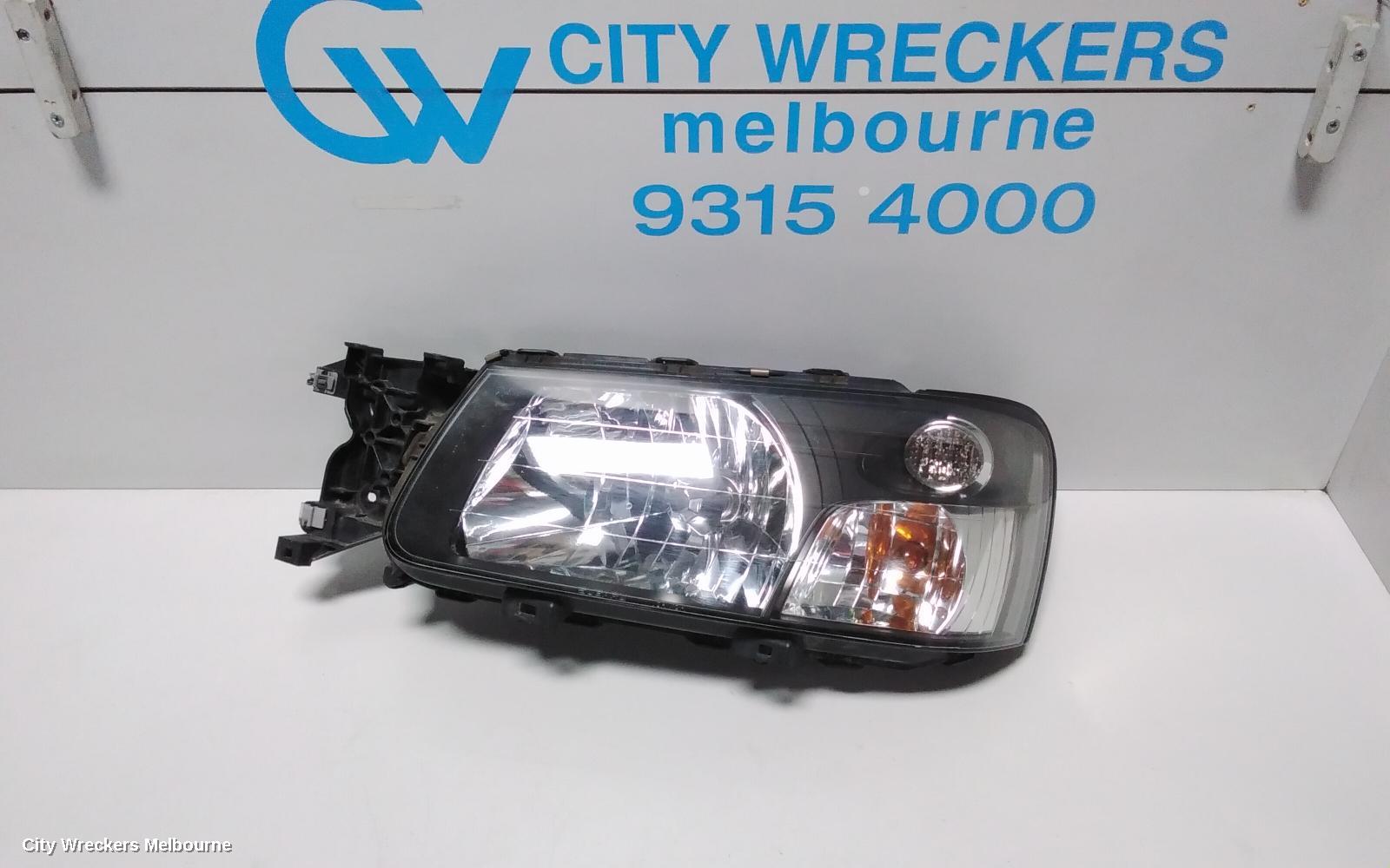 SUBARU FORESTER LEFT HEADLAMP, BLACK INSERT (CURVED LINES), LENS# 1700, 08/2004 - 05/2005 - Image 1