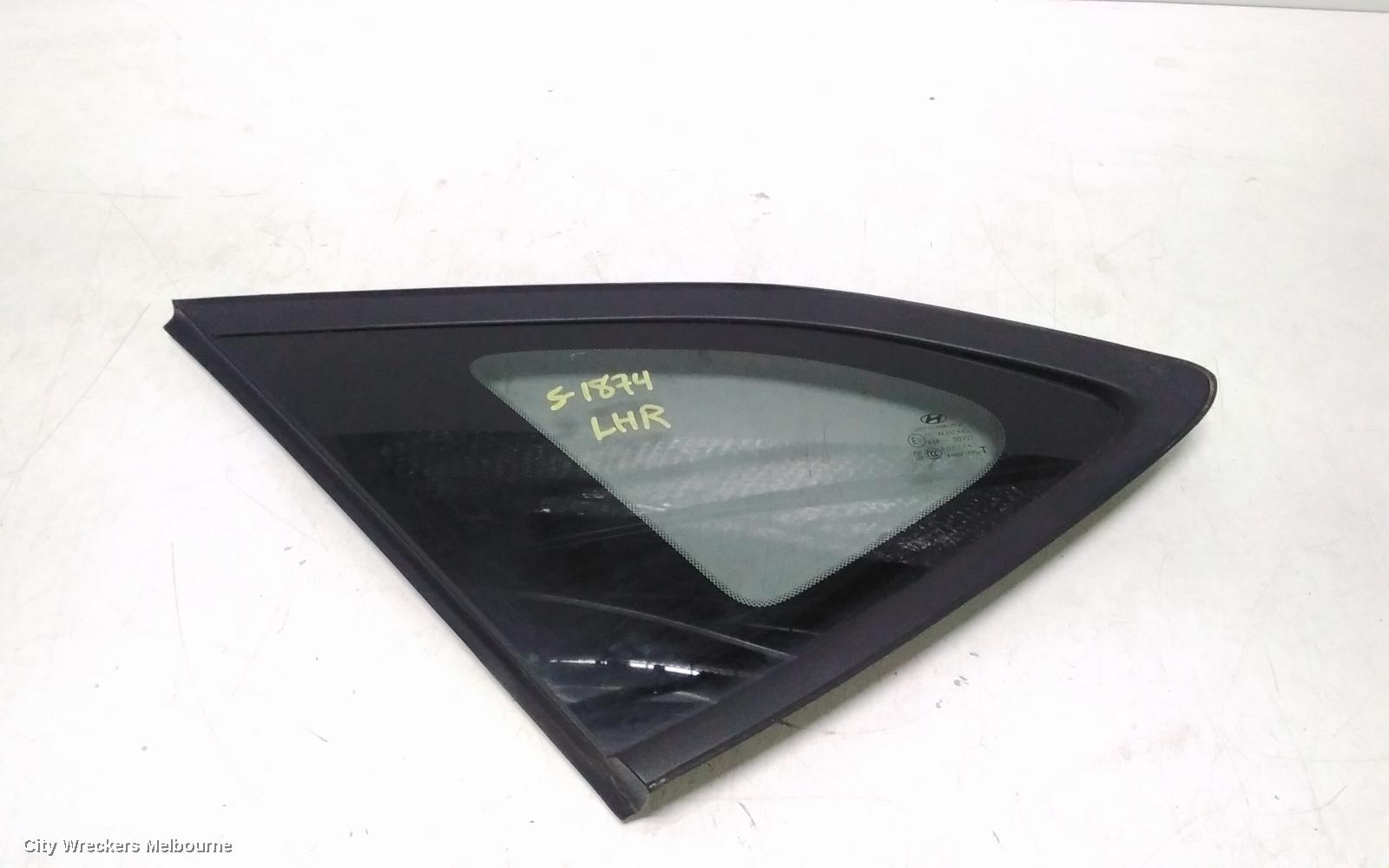 HYUNDAI TUCSON LEFT REAR SIDE GLASS, TL, BLACK TRIM TYPE, 07/2015 - 01/2021 - Image 1
