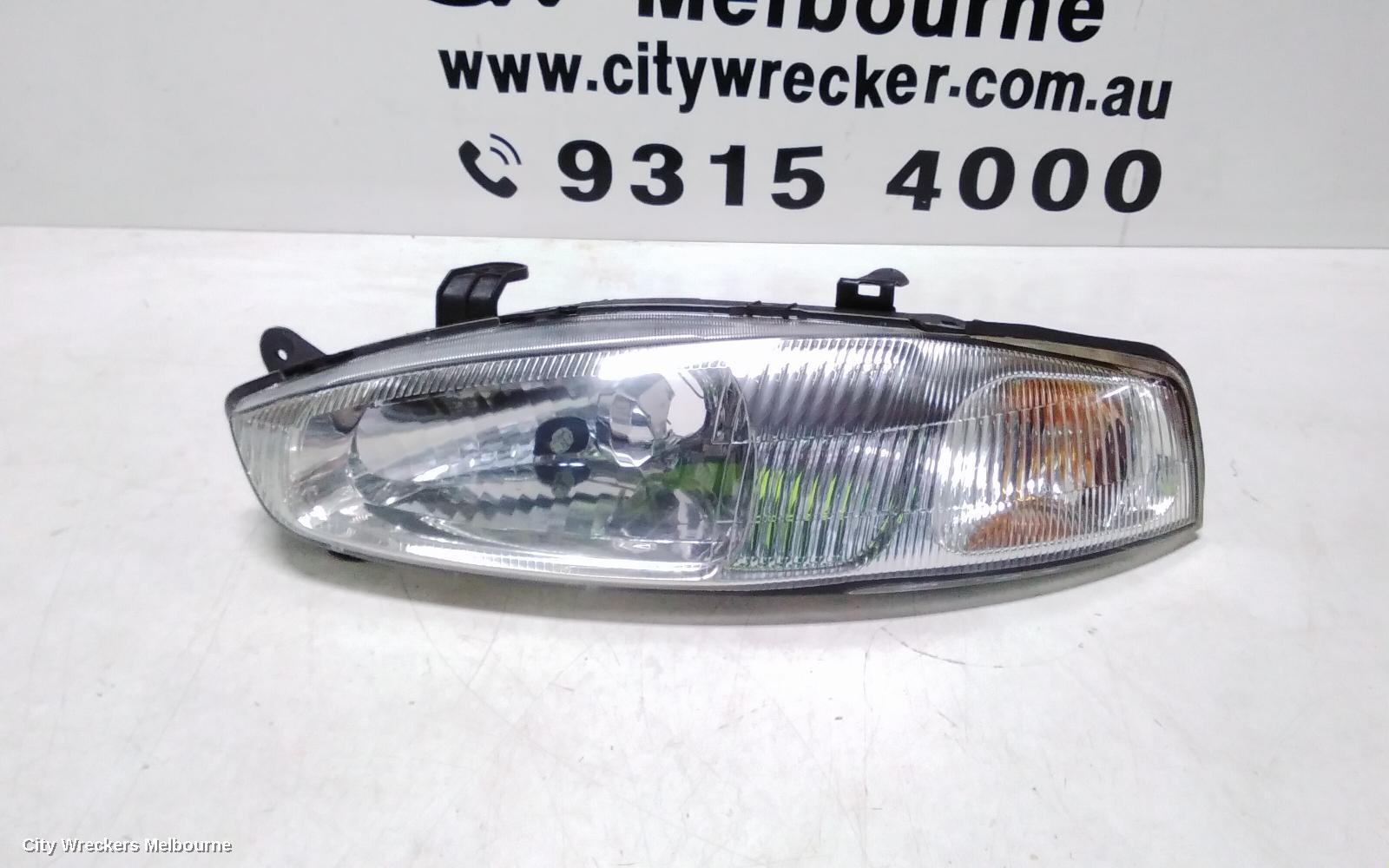 MITSUBISHI LANCER LEFT HEADLAMP, CE/CJ, LANCER (MIRAGE NZ), HATCH/COUPE, 1 PIECE W/ CORNER LAMP, PLASTIC TYPE, 07/1996 - 08/2003 - Image 2