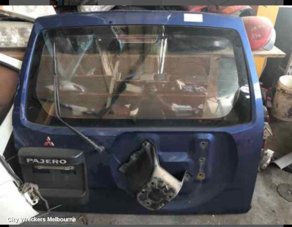 MITSUBISHI PAJERO BOOTLID/TAILGATE, TAILGATE, NON-SPOILER TYPE, RH SIDE WHEEL CARRIER, NON LOWER MOULD TYPE, NP, 11/2002 - 09/2006 - Image 1