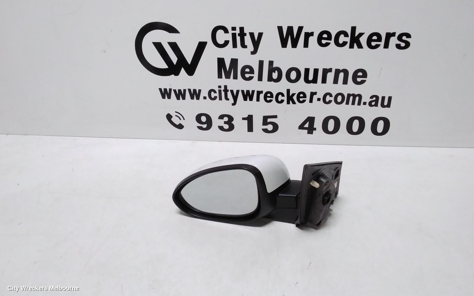 HOLDEN BARINA LEFT DOOR MIRROR, TM, COLOUR CODED, 09/2011 - 12/2018 - Image 1
