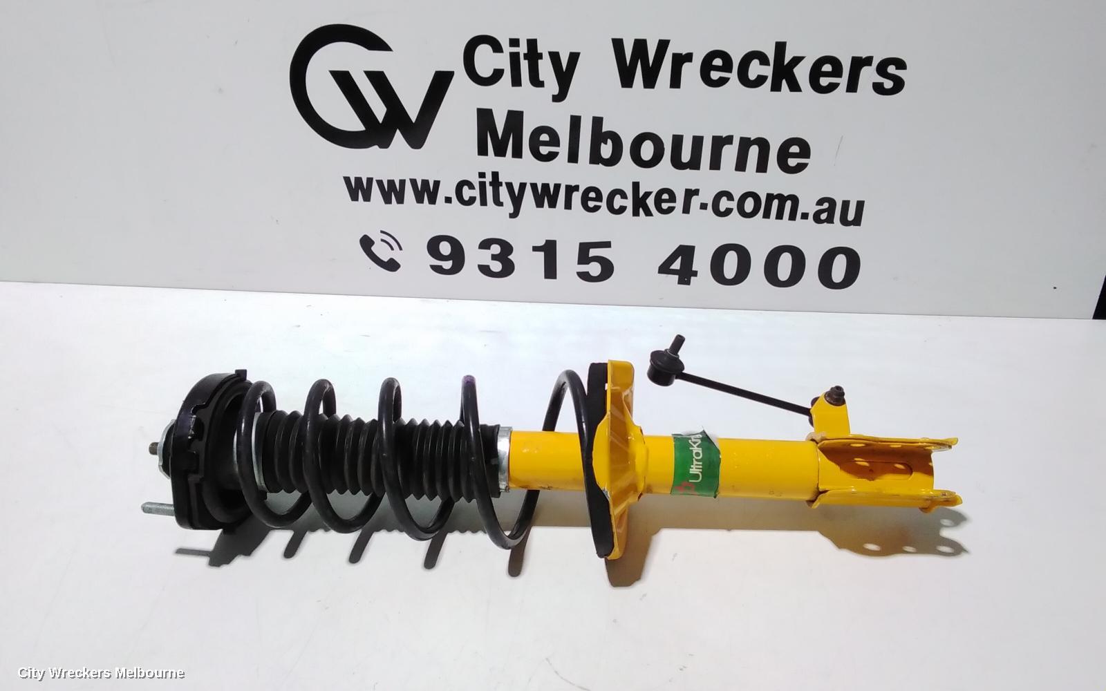 MAZDA 323 LEFT FRONT STRUT, BJ, 1.6/1.8, ZM/FP, LOW MOUNT SWAY BAR TYPE, 09/1998 - 12/2003 - Image 1
