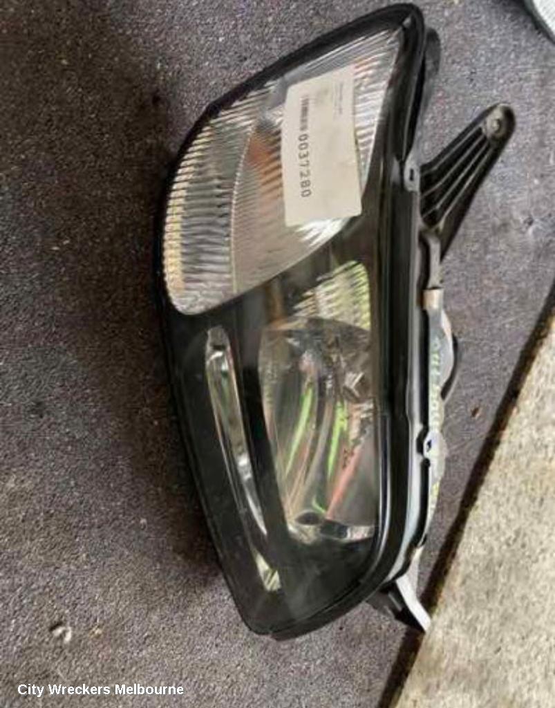 SUBARU LIBERTY LEFT HEADLAMP, 3RD GEN, BLACK INSERT, 11/1998 - 06/2001 - Image 1
