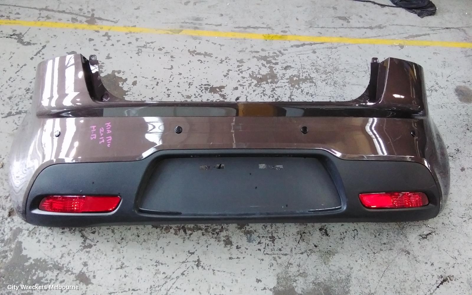 KIA RIO REAR BUMPER, UB, BUMPER BAR, 3DR/5DR HATCH, W/ PARK SENSOR TYPE, 08/2011 - 10/2014 - Image 1
