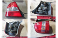 MAZDA 323 LEFT TAILLIGHT, BJ, SEDAN, CLEAR TYPE, KOITO LENS# 220-61866, 09/1998 - 05/2002 - Image 1