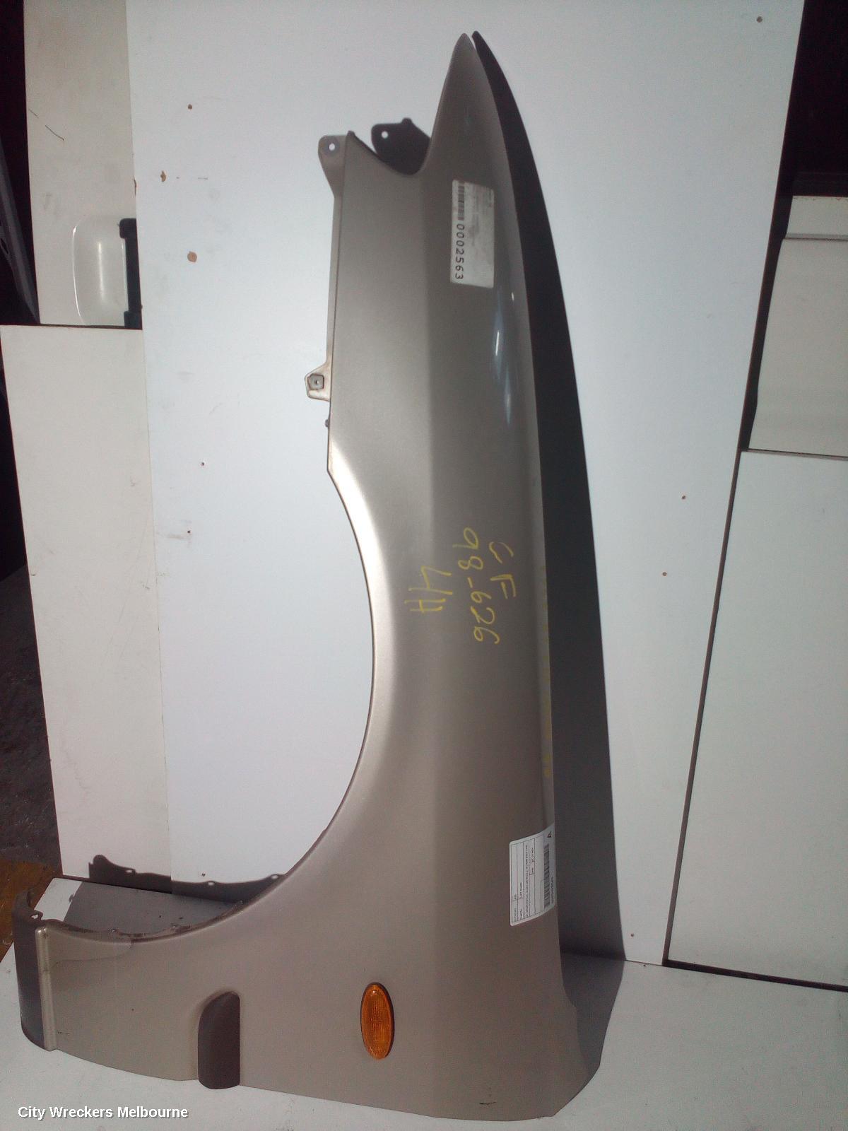 MAZDA 626 LEFT GUARD, GF, SEDAN/HATCH, GLUED ON MOULD, W/ REPEATER TYPE, 08/1997 - 11/1999 - Image 1