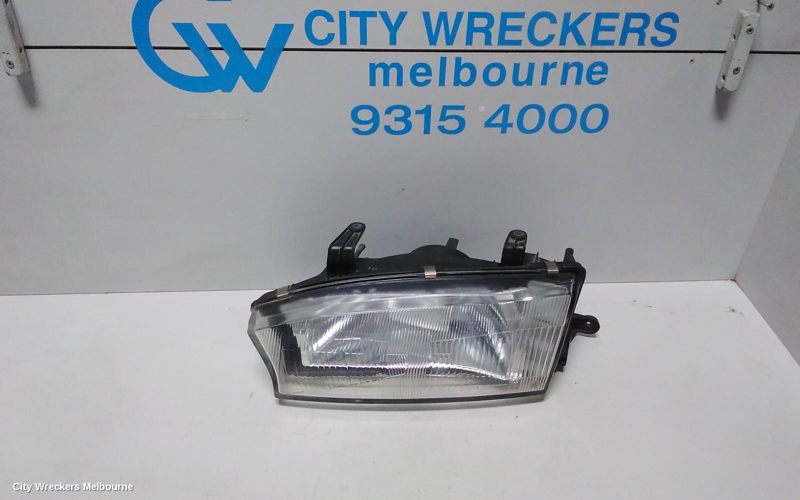 SUBARU LIBERTY LEFT HEADLAMP, 2ND GEN, KOITO LENS# 100-20588, 06/1994 - 01/1999 - Image 1