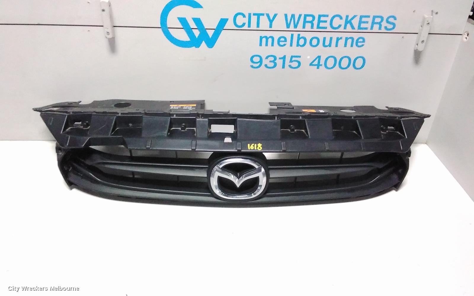 MAZDA 2 GRILLE, RADIATOR GRILLE, DJ, GENKI, UPPER-COLOUR CODED, 09/2014 - 10/2019 - Image 1