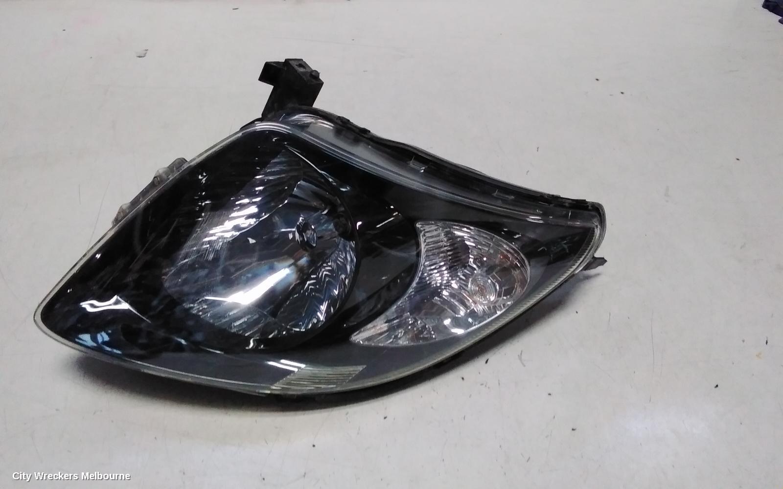 SUZUKI SWIFT RIGHT HEADLAMP, RS415, MAN BEAM ADJUSTMENT, BLACK INSERT TYPE, 09/2004 - 02/2011 - Image 1