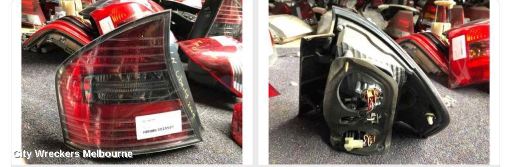 SUBARU LIBERTY LEFT TAILLIGHT, 4TH GEN, SEDAN, TINTED TYPE, 4 BULB, 09/2003 - 06/2006 - Image 1