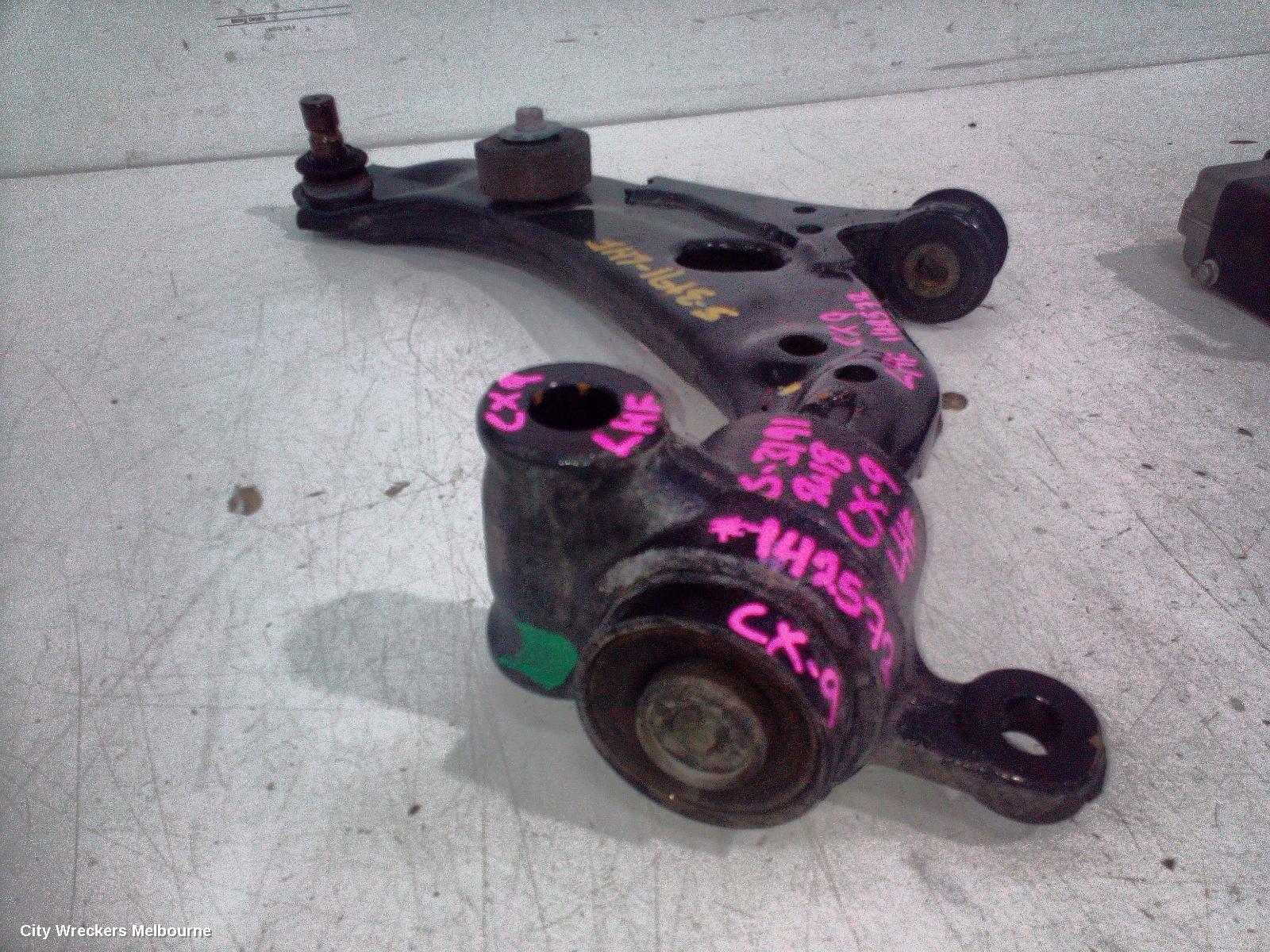 MAZDA CX9 LEFT FRONT LOWER CONTROL ARM, TC, 07/2016 - 12/2024 - Image 1