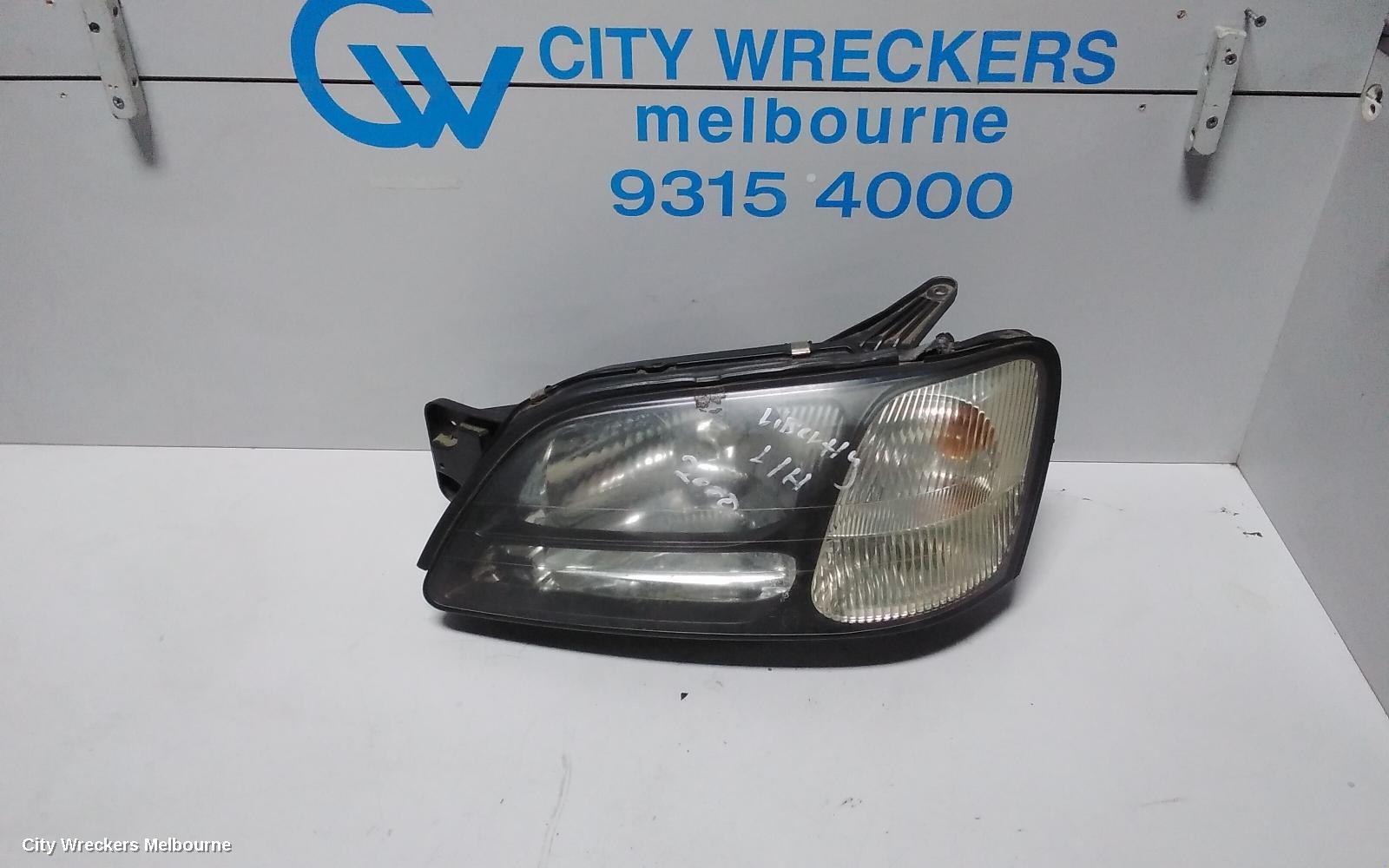 SUBARU LIBERTY LEFT HEADLAMP, 3RD GEN, BLACK INSERT, 11/1998 - 06/2001 - Image 1