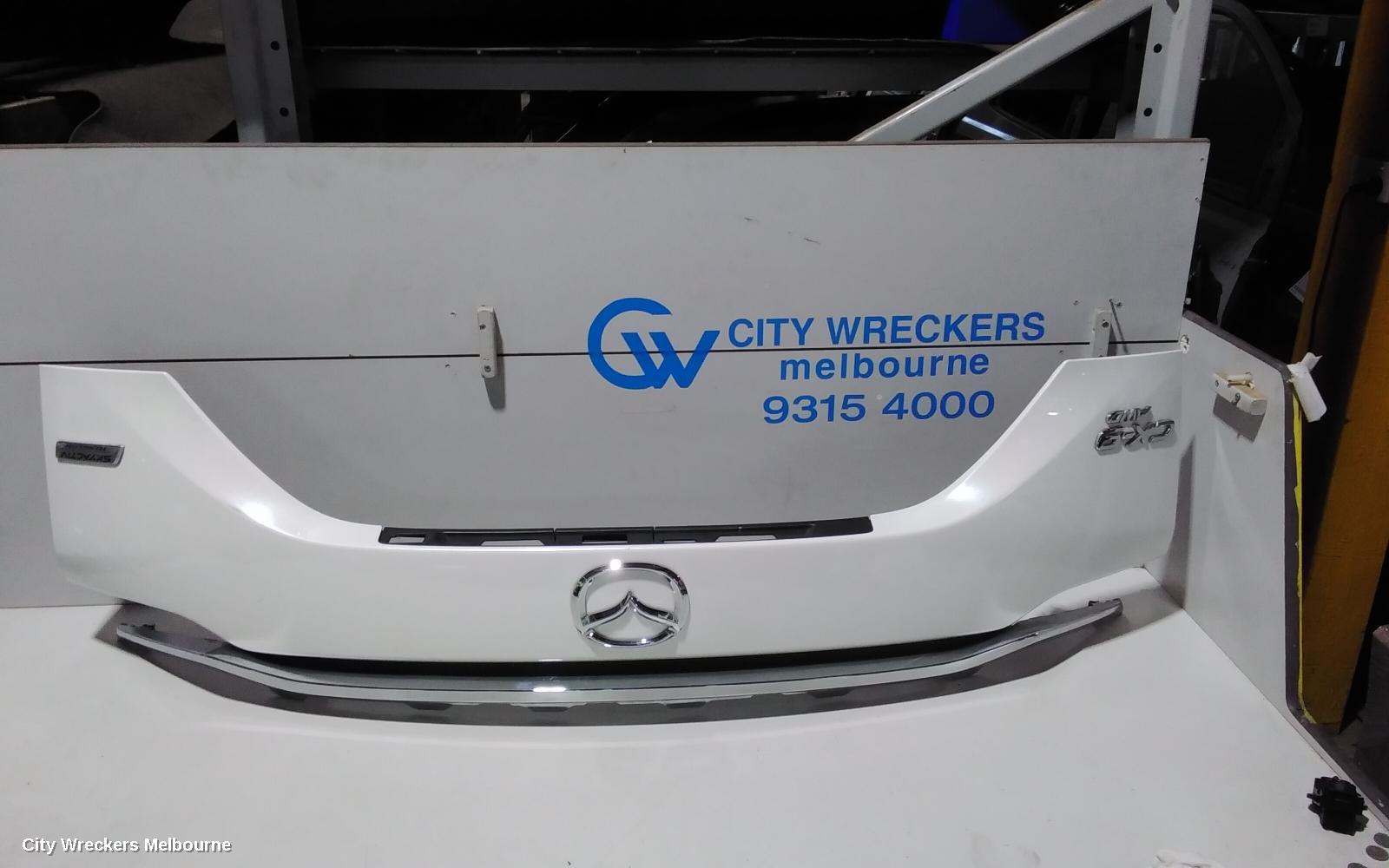 MAZDA CX9 REAR GARNISH, TAILGATE GARNISH-LOWER, COLOUR CODED, TC, 07/2016 ONWARDS - Image 1