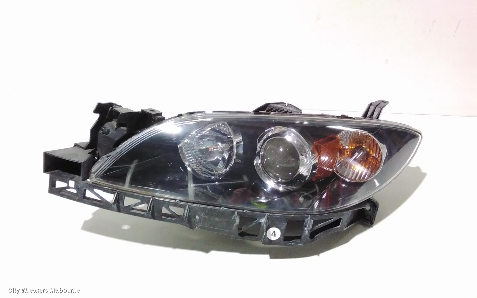 MAZDA 3 LEFT HEADLAMP, BK, SEDAN, NON HID, MANUAL ADJUST TYPE, 10/2003 - 04/2009 - Image 1