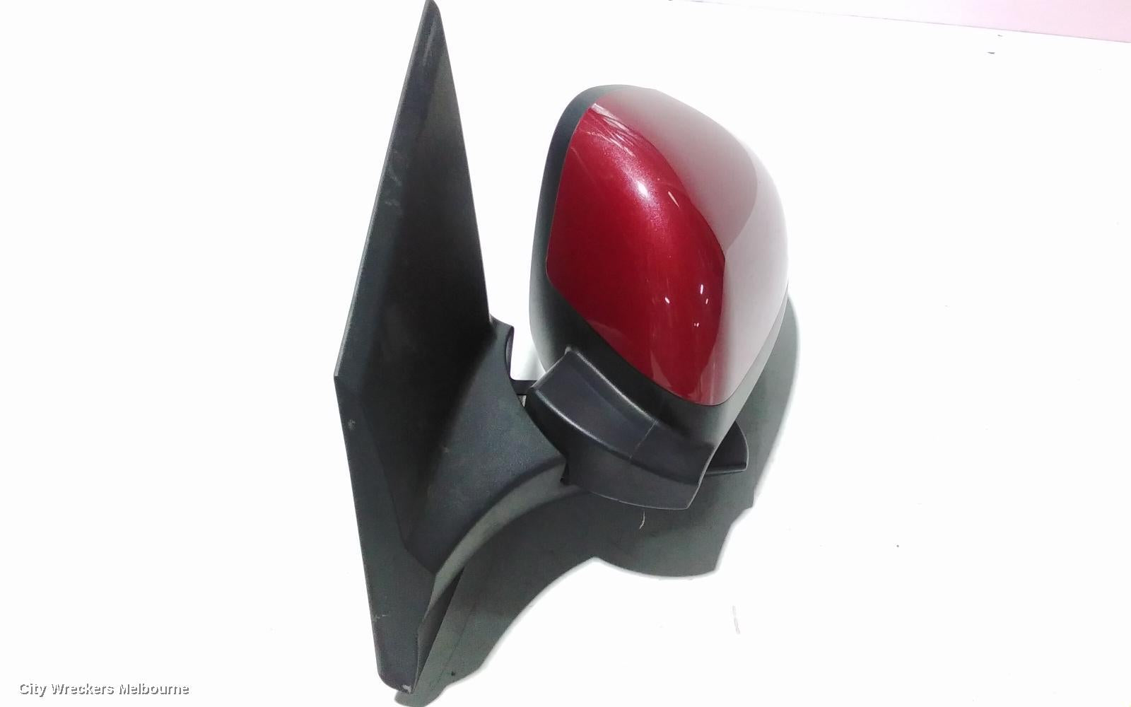 HOLDEN BARINA LEFT DOOR MIRROR, TM, COLOUR CODED, 11/2011 - 12/2018 - Image 1