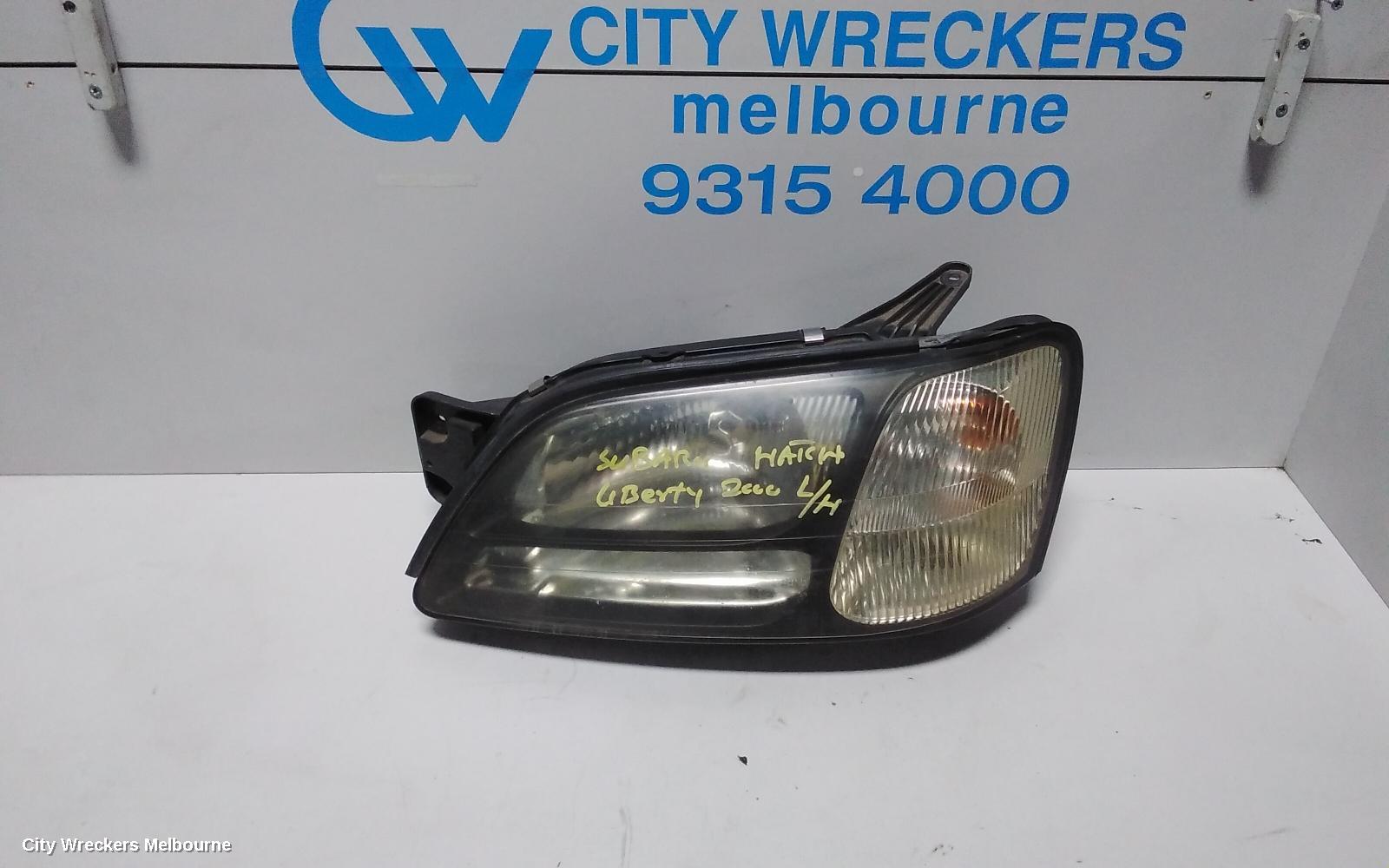 SUBARU LIBERTY LEFT HEADLAMP, 3RD GEN, BLACK INSERT, 11/1998 - 06/2001 - Image 1