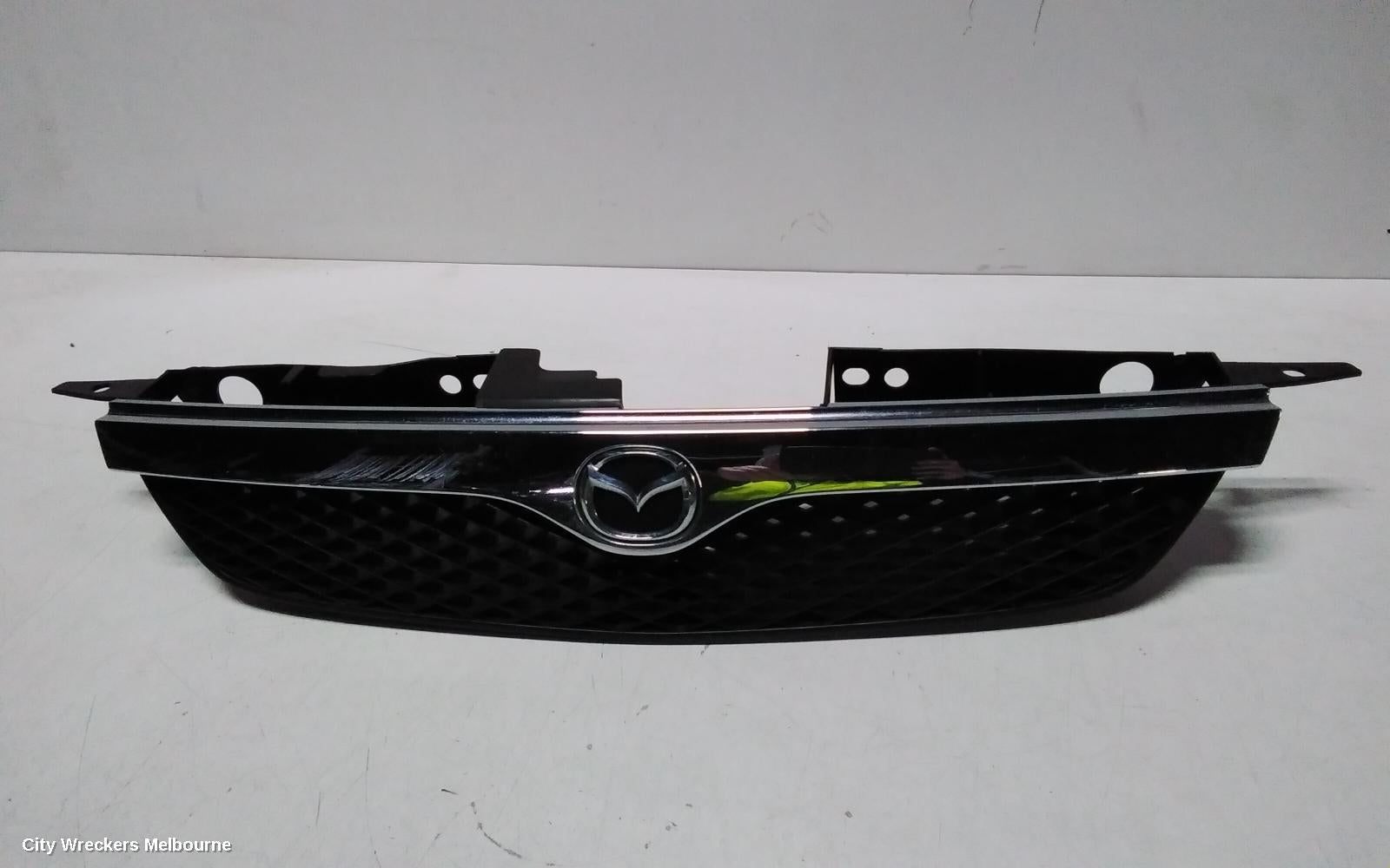 MAZDA 323 GRILLE, RADIATOR GRILLE, BJ, W/ CHROME MOULD TYPE, 09/1998 - 03/2001 - Image 1