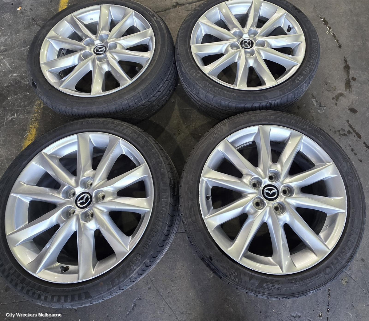 MAZDA 3 WHEEL MAG, FACTORY, 18X7IN, LIGHT GREY, BN, 05/2016 - 02/2019 - Image 1