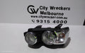 HOLDEN BARINA LEFT HEADLAMP, TM, W/ CHROME RING TYPE, 11/2011 - 08/2016 - Image 1
