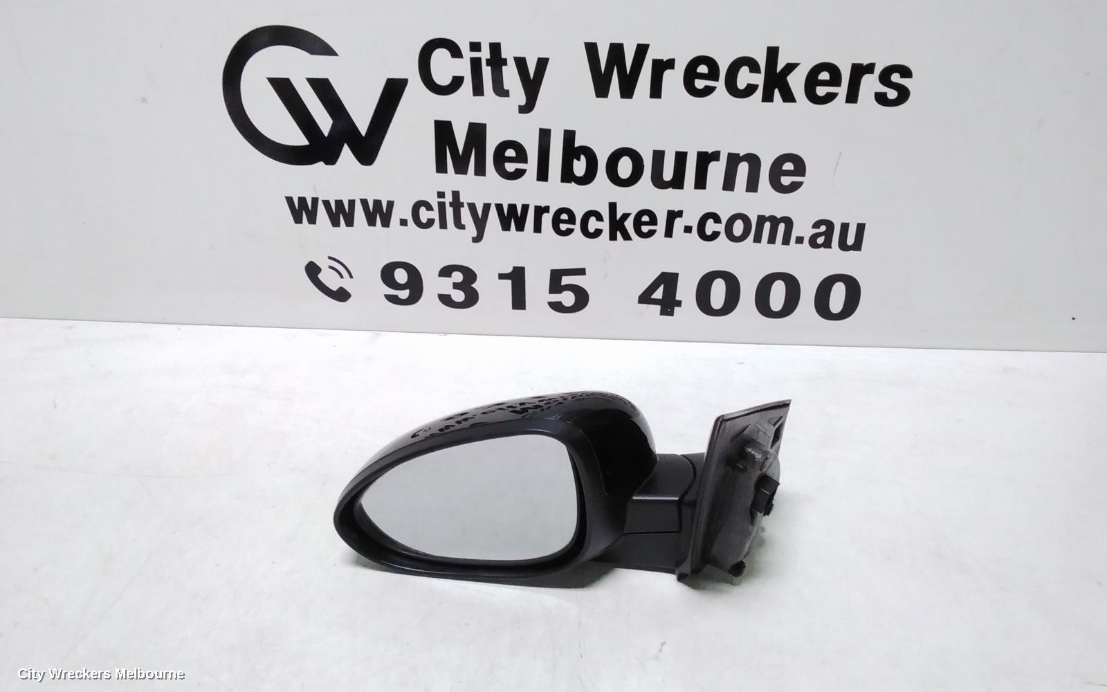 HOLDEN BARINA LEFT DOOR MIRROR, TM, COLOUR CODED, 09/2011 - 12/2018 - Image 1
