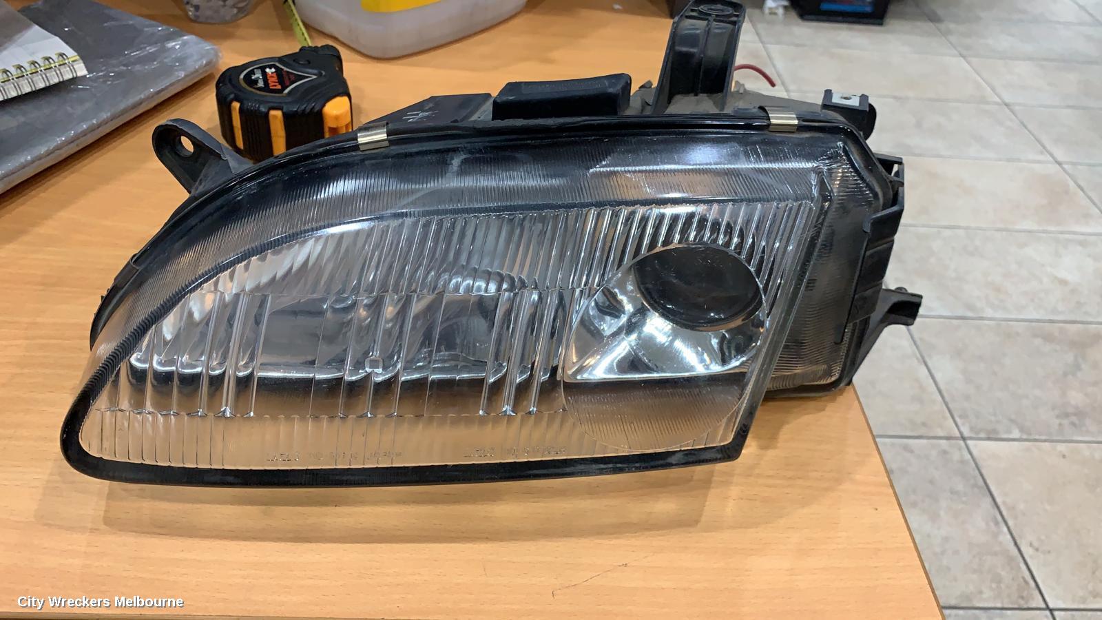 MAZDA ASTINA LEFT HEADLAMP, BA 4DR (KOITO 110-61719) 06/1994 - 08/1998 - Image 1
