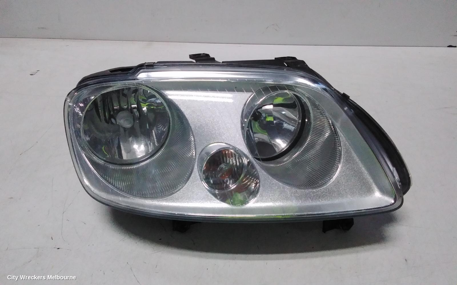 VOLKSWAGEN CADDY RIGHT HEADLAMP, 2K, CHROME INSERT TYPE, 12/2004 - 08/2010 - Image 1