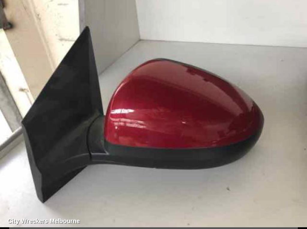 HOLDEN BARINA LEFT DOOR MIRROR, TM, COLOUR CODED, 09/2011 - 12/2018 - Image 1