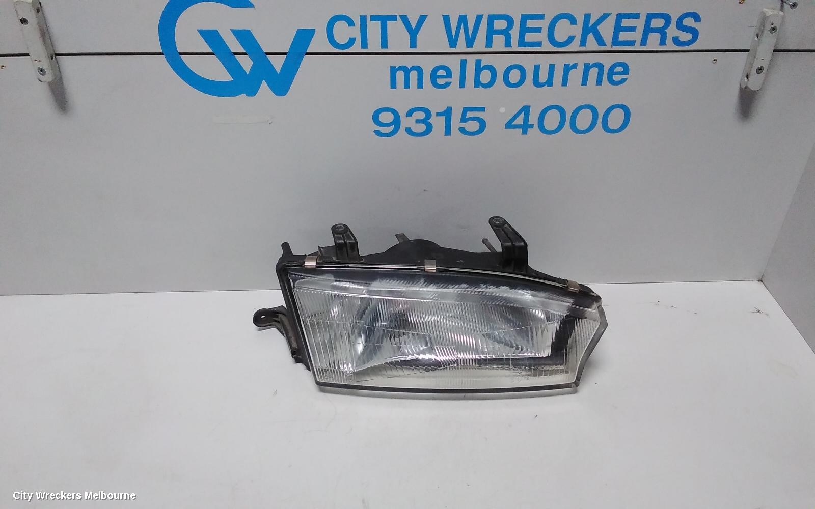SUBARU LIBERTY RIGHT HEADLAMP, 2ND GEN, KOITO LENS# 100-20588, 06/1994 - 01/1999 - Image 1