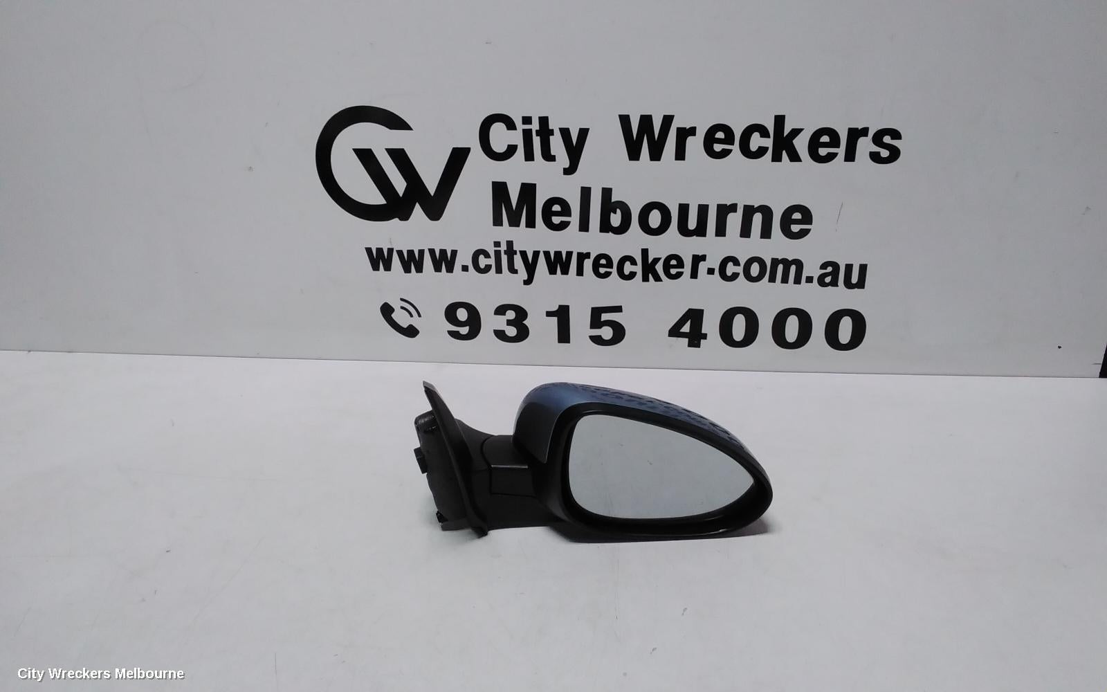 HOLDEN BARINA RIGHT DOOR MIRROR, TM, COLOUR CODED, 09/2011 - 12/2018 - Image 1